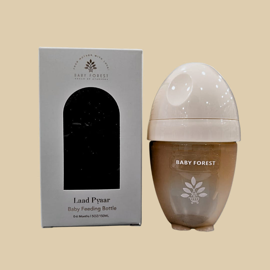 Baby feeding bottle with 'Baby Forest' branding and packaging on a white background