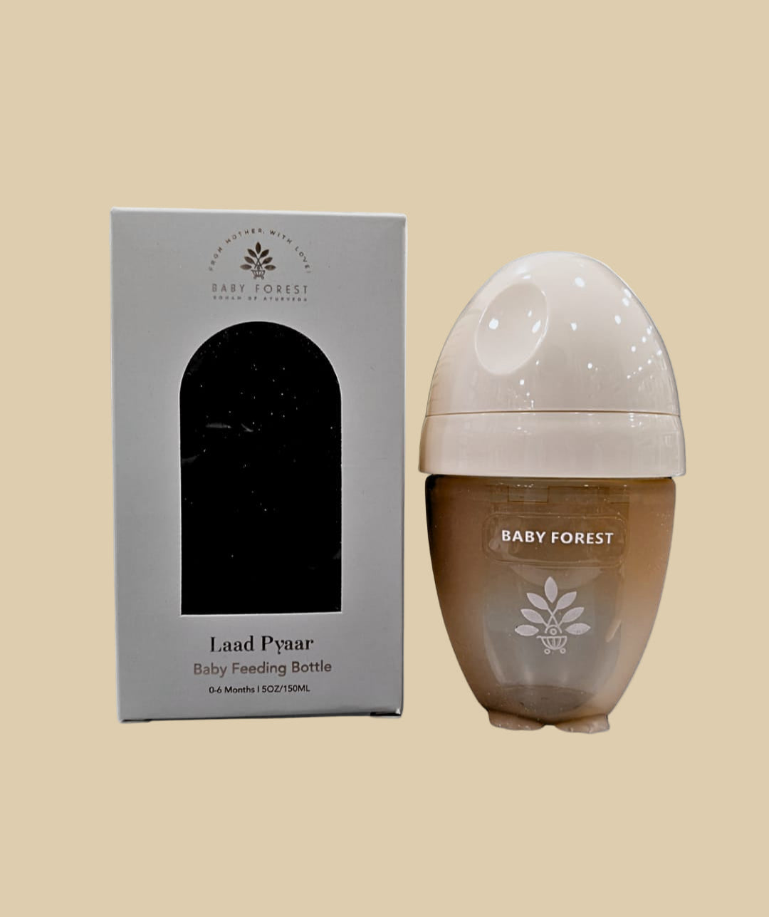 Baby feeding bottle with 'Baby Forest' branding and packaging on a white background