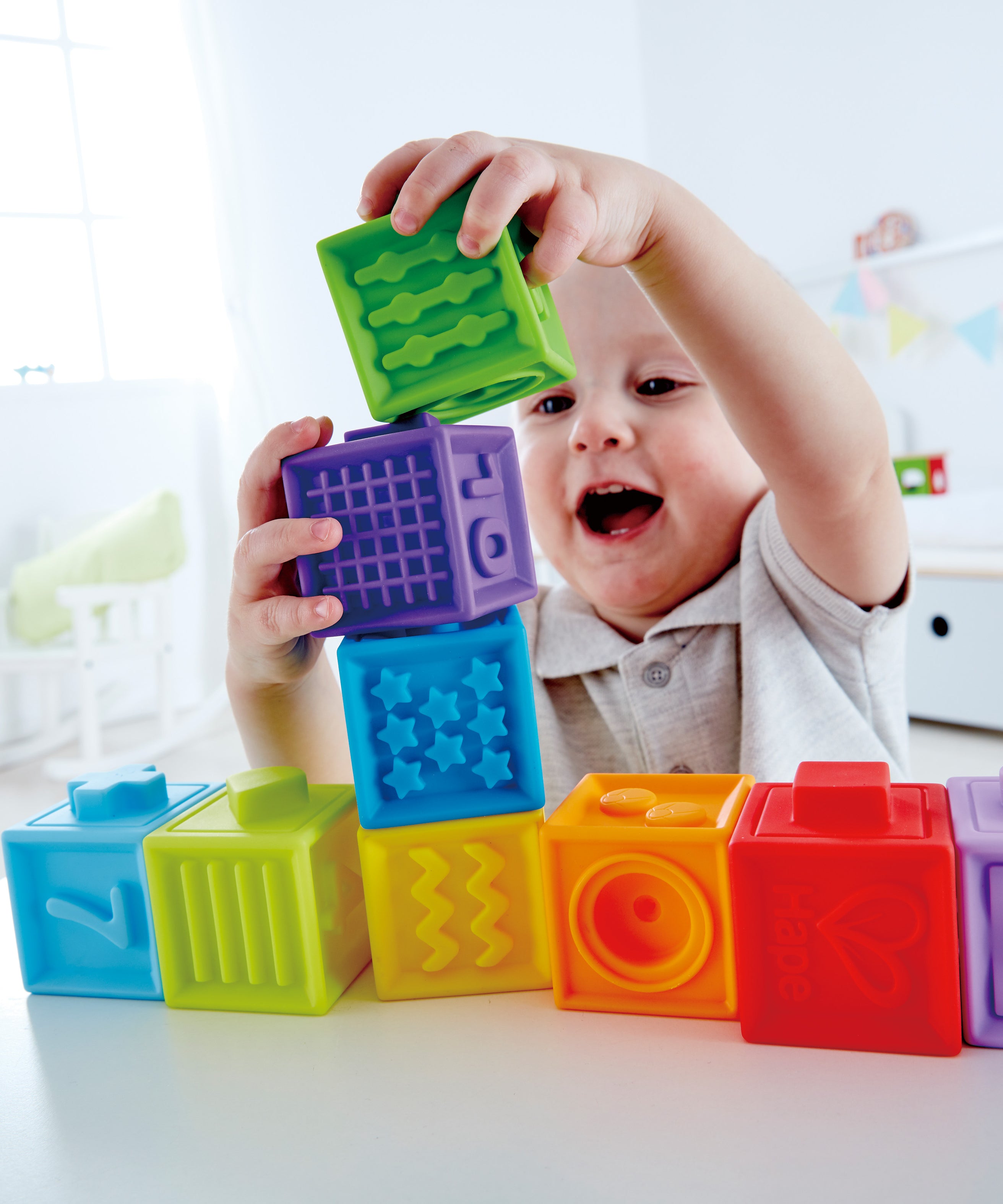 Hape Squeeze Me Blocks Soft Silicone Stacking Toy 10pcs – Colorful Textured Blocks for Teething, Stacking, and Early Learning