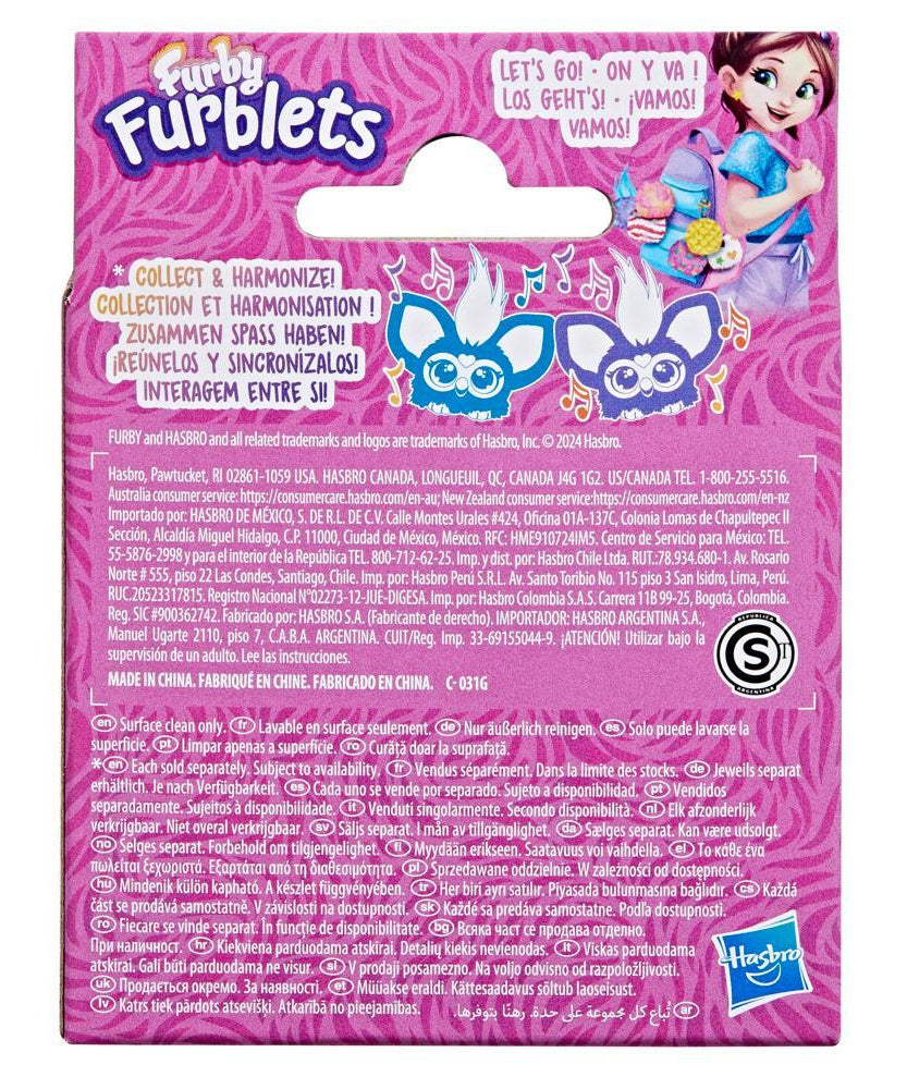 Back of a Furby Furblets packaging with pink background and character illustration.