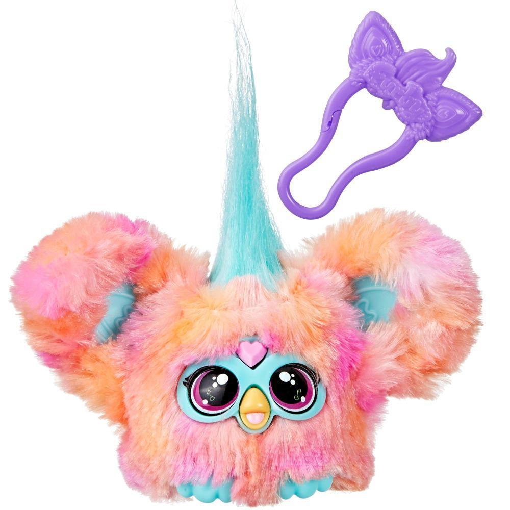 Colorful fluffy toy with a purple hair clip on a white background