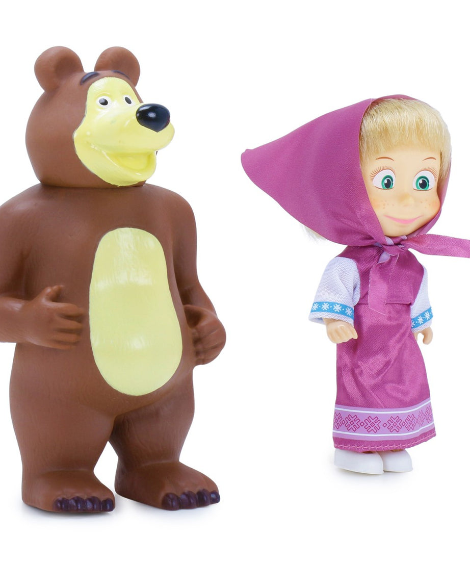 Toy bear and doll with pink hood on a white background
