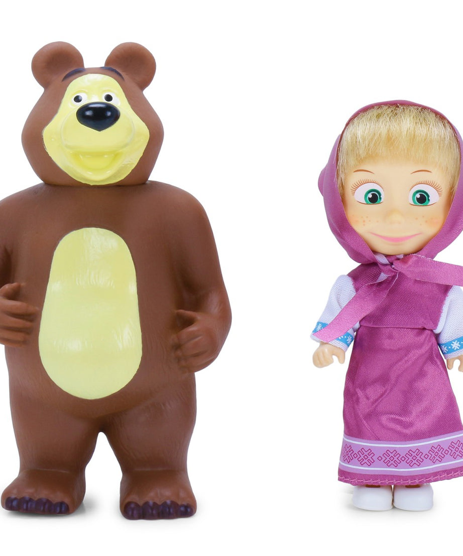 Toy bear and doll with traditional outfit on a white background