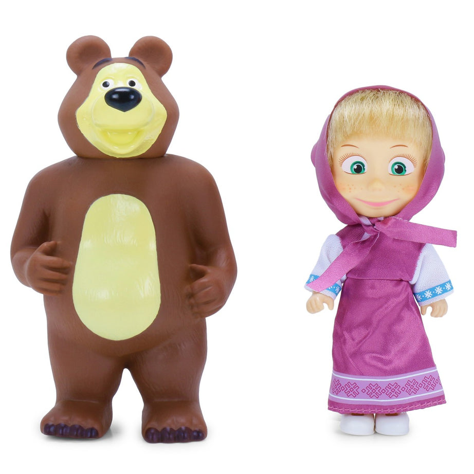 Toy bear and doll with traditional outfit on a white background