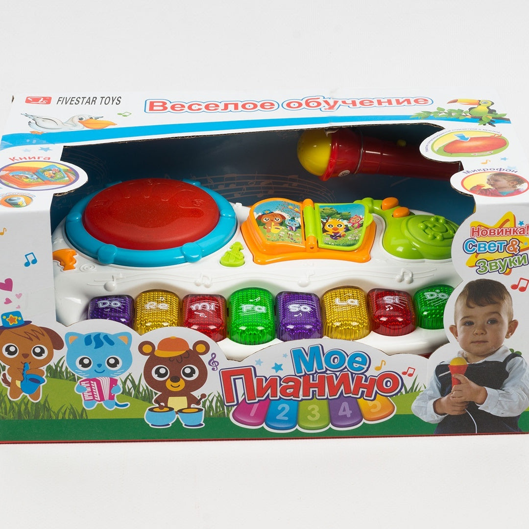 Colorful toy set with educational elements in a box on a white background