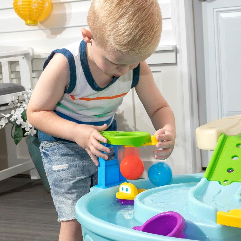 Step2 Ball Buddies Adventure Center Water Table - Two-Tier Water Play Table with Dump Truck, Train, Boat & Helicopter Toys | 22-Piece Accessory Set | For Toddlers 2+ Years | Outdoor Sensory STEM Activity Table - MINIMEE KIDS
