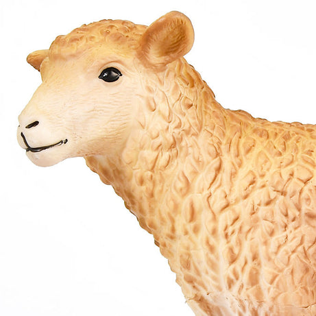 Close-up of a beige sheep figurine on a white background
