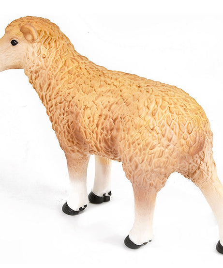 Toy sheep figure on a white background