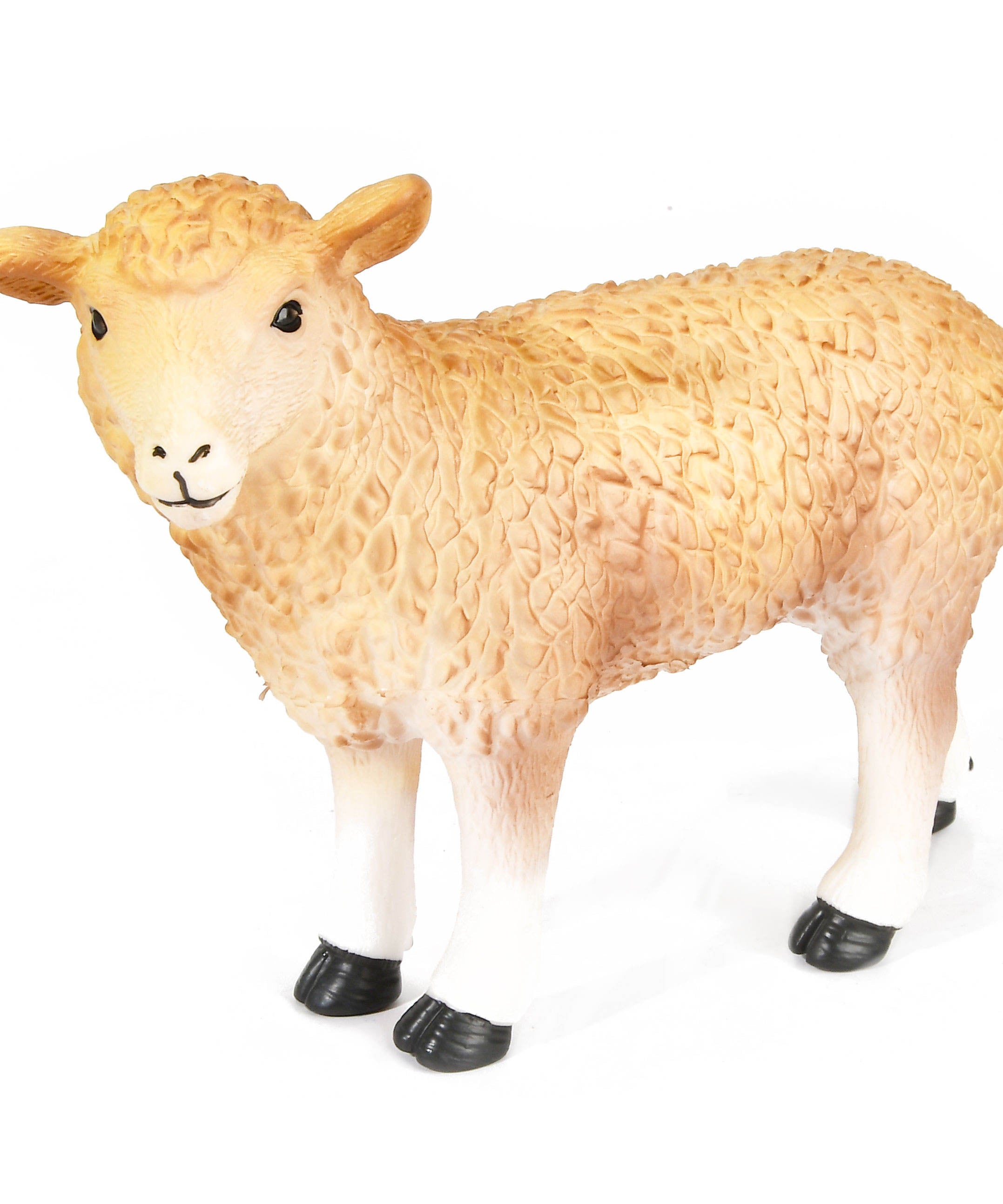 Sheep figurine with black shoes on a white background